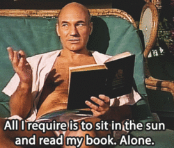 Sir Patrick Stewart reclines in a bed with a book in hand. The caption reads, "All I require is to sit in the sun and read my book. Alone."